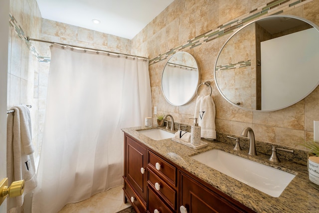 bathroom featuring tile walls, vanity, backsplash, and tile patterned flooring