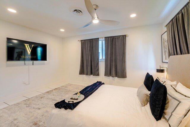 tiled bedroom featuring ceiling fan