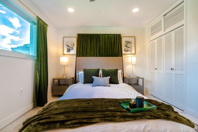 carpeted bedroom with a closet