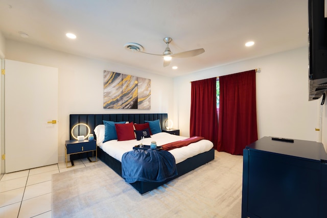 tiled bedroom featuring ceiling fan