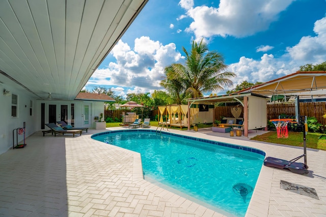 view of pool featuring a gazebo, a patio area, and french doors