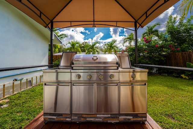 view of patio featuring grilling area and a gazebo