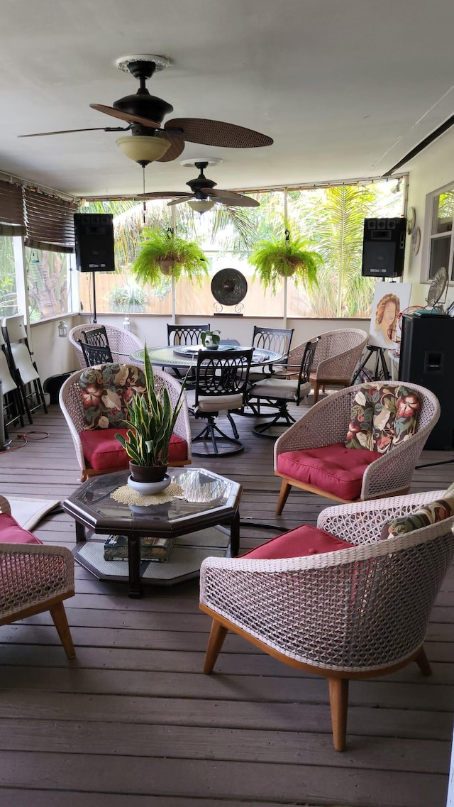 wooden deck with an outdoor hangout area and ceiling fan