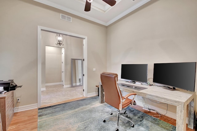 office featuring crown molding, ceiling fan, and light hardwood / wood-style flooring