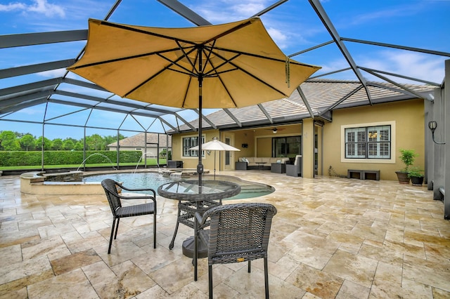 view of patio with glass enclosure, an outdoor hangout area, pool water feature, ceiling fan, and a pool with hot tub