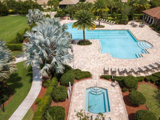 view of swimming pool with a yard and a patio area