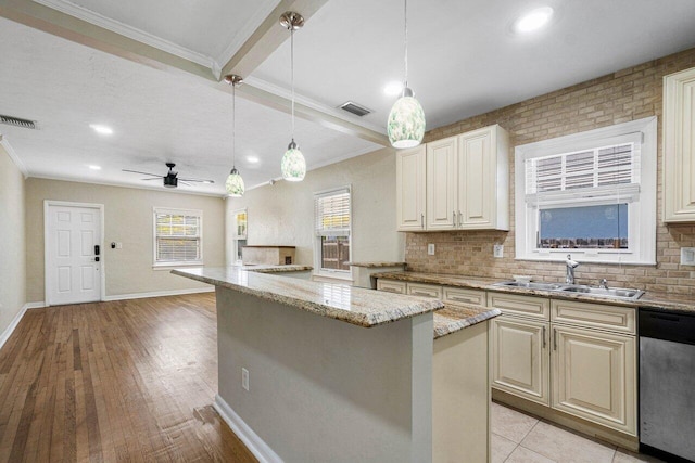 kitchen featuring light stone countertops, dishwasher, light wood-type flooring, ceiling fan, and sink