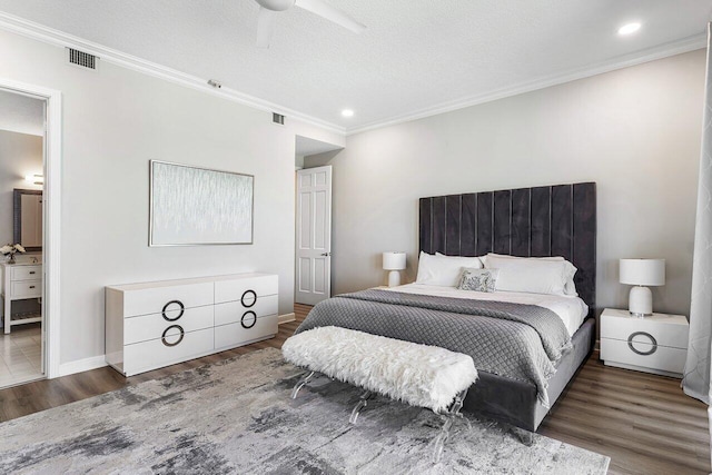 bedroom with ceiling fan, crown molding, dark hardwood / wood-style floors, and a textured ceiling