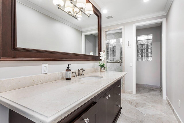 bathroom featuring crown molding, vanity, and a notable chandelier