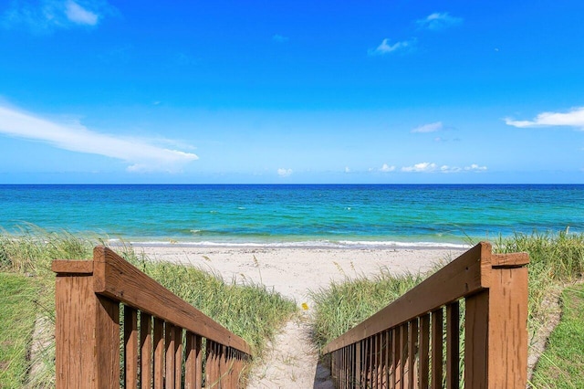 view of water feature with a beach view