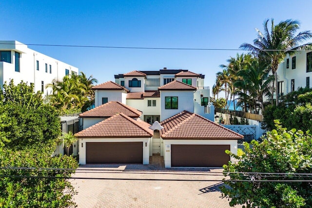 mediterranean / spanish-style home featuring a garage