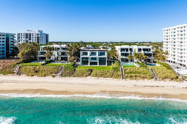 bird's eye view with a water view and a view of the beach