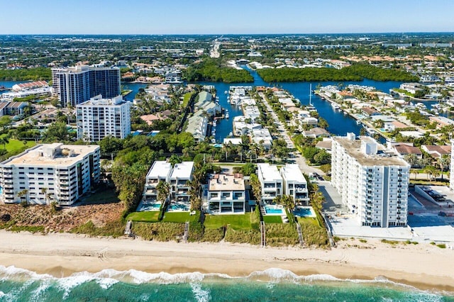 bird's eye view featuring a beach view and a water view