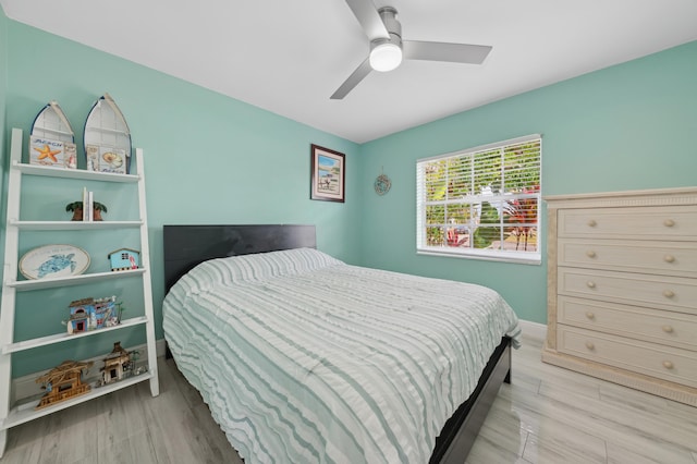 bedroom featuring ceiling fan and light hardwood / wood-style floors