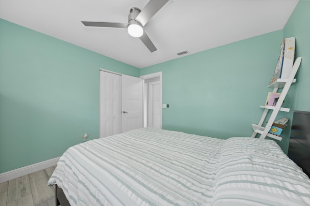 bedroom featuring multiple windows and ceiling fan