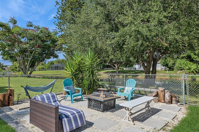 view of patio / terrace featuring an outdoor fire pit