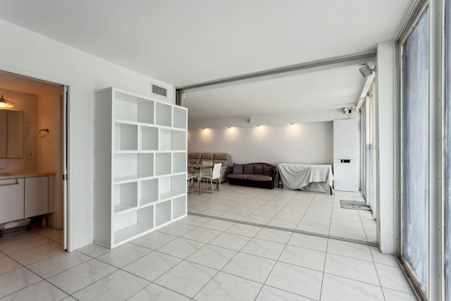 interior space with light tile patterned floors