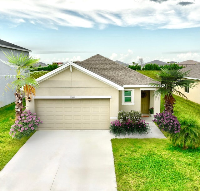 single story home with a front yard and a garage