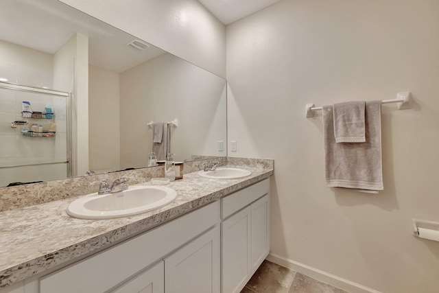 bathroom featuring vanity and an enclosed shower