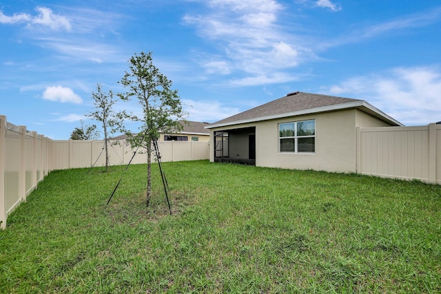 view of front of property with a front yard and a garage