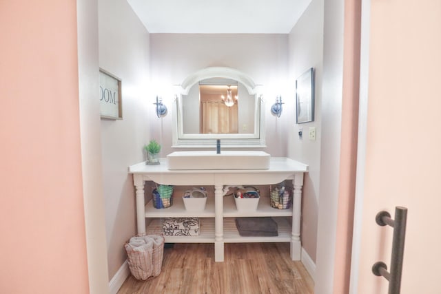 bathroom with sink and hardwood / wood-style flooring