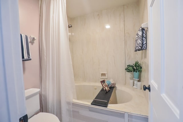 full bathroom featuring vanity, shower / bath combo with shower curtain, and toilet