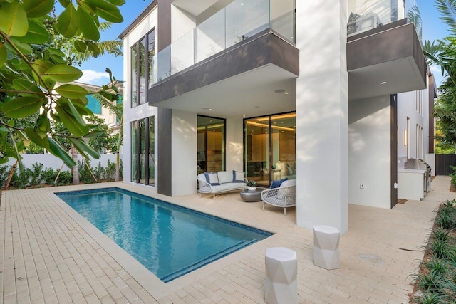 view of swimming pool with a patio area