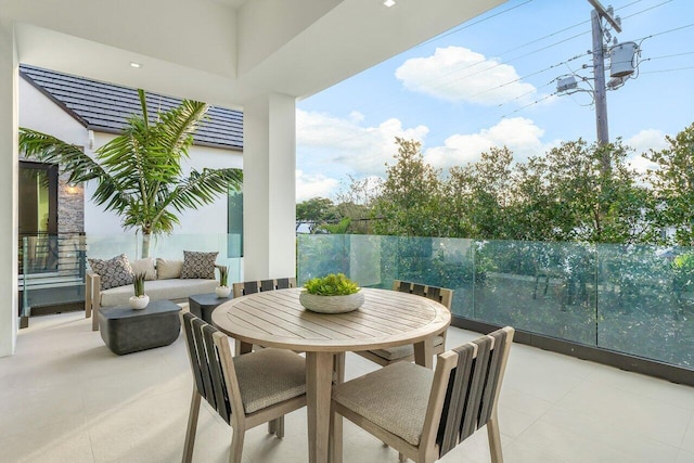 view of patio with a balcony and outdoor lounge area