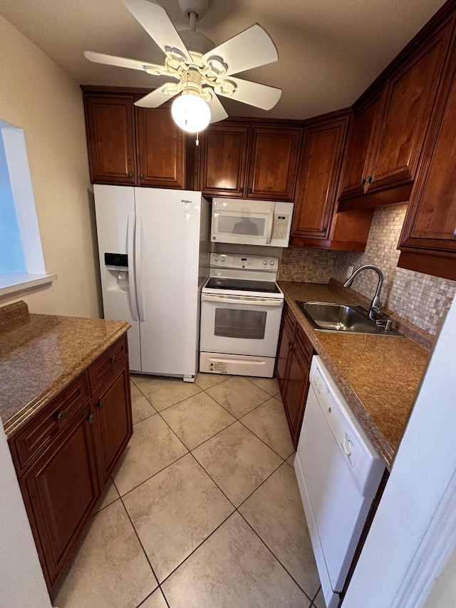 kitchen featuring white appliances, light tile patterned flooring, backsplash, ceiling fan, and sink