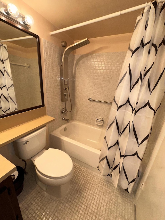 bathroom featuring toilet, shower / tub combo, tile patterned flooring, and vanity