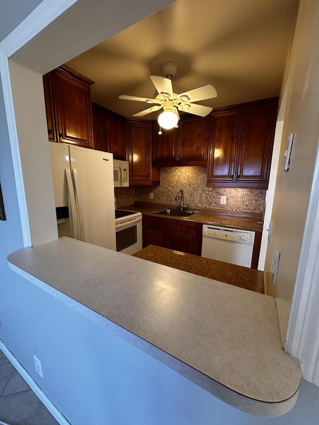 kitchen with white appliances, ceiling fan, sink, tasteful backsplash, and tile patterned floors