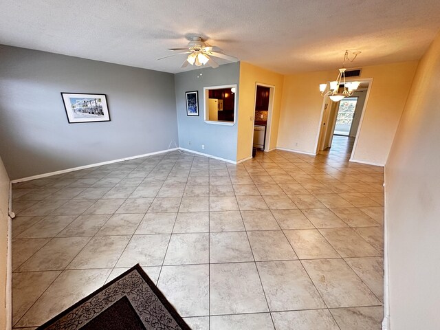 tiled spare room with ceiling fan