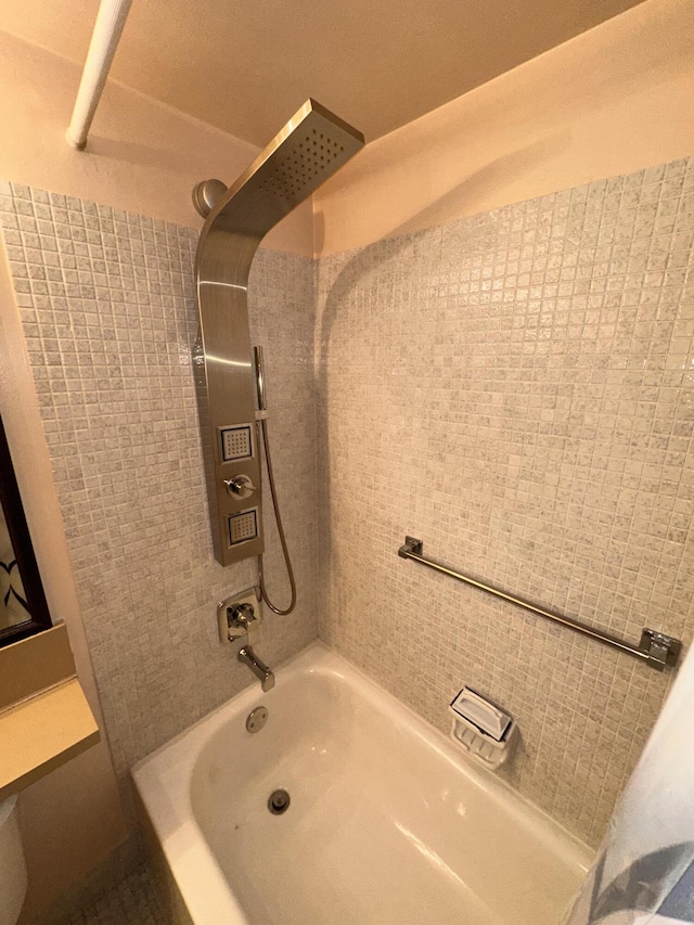 bathroom with washtub / shower combination