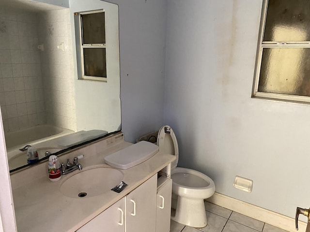 bathroom with tile patterned floors, vanity, and toilet