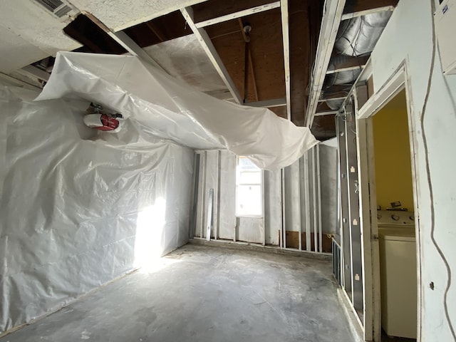 misc room with concrete flooring and washer / clothes dryer