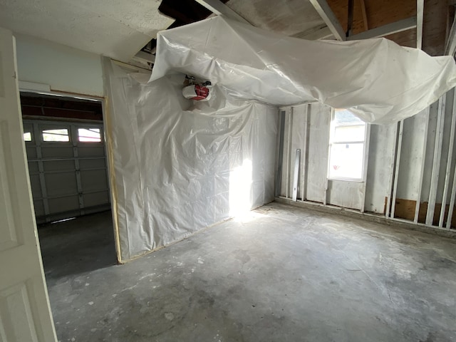 misc room with concrete flooring