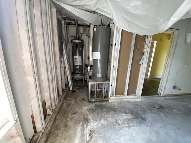 utility room featuring gas water heater