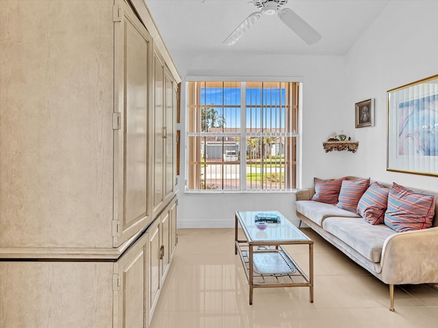 living room featuring light tile patterned floors and ceiling fan