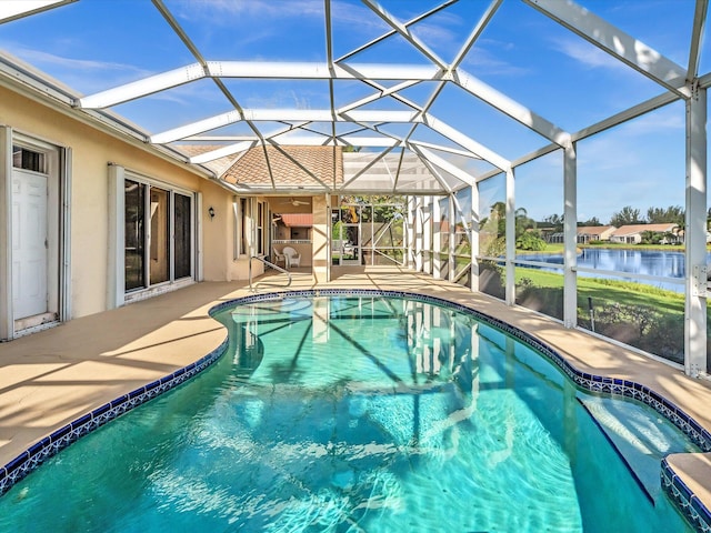 view of pool with a patio area and a lanai