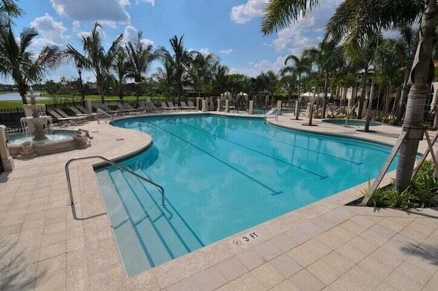 view of pool featuring a patio area