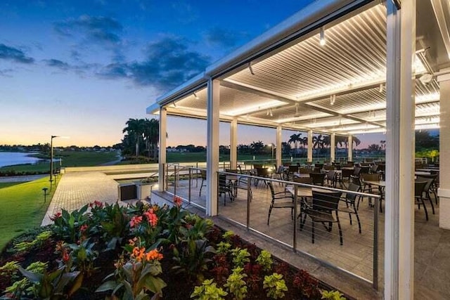 view of patio terrace at dusk