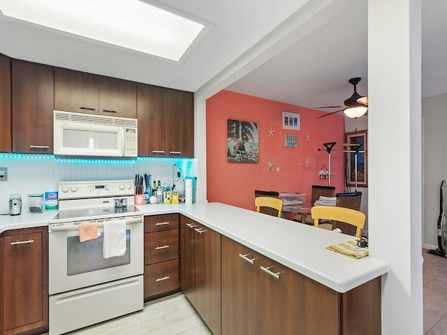 kitchen with kitchen peninsula, light wood-type flooring, backsplash, white appliances, and ceiling fan