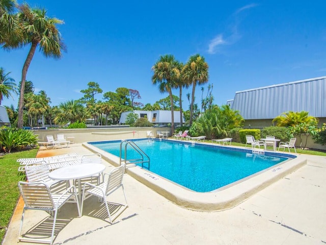 view of swimming pool with a patio