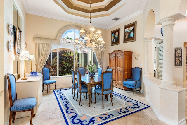 dining area featuring ornate columns, ornamental molding, a wealth of natural light, and a tray ceiling