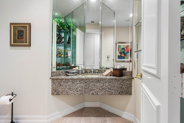 bathroom featuring tile patterned flooring and sink