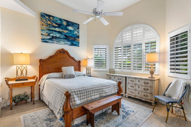 bedroom featuring vaulted ceiling and ceiling fan