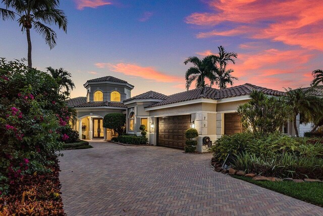 mediterranean / spanish-style home featuring a garage