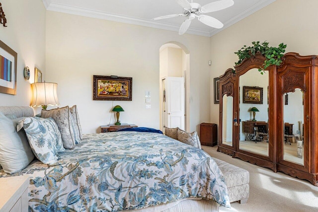 bedroom with crown molding, carpet flooring, and ceiling fan