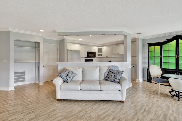 living room featuring a textured ceiling, crown molding, and light tile patterned flooring