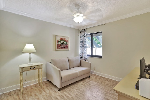 living room featuring ceiling fan, a textured ceiling, and crown molding